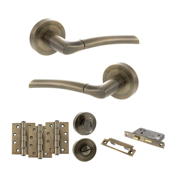 STATUS Indiana Door Handle Pack (Bathroom Set - 2.5" CE Bathroom Lock, 4" Fire Rated Hinges x3) - Antique Brass - ADPS33RAB10 - Choice Handles