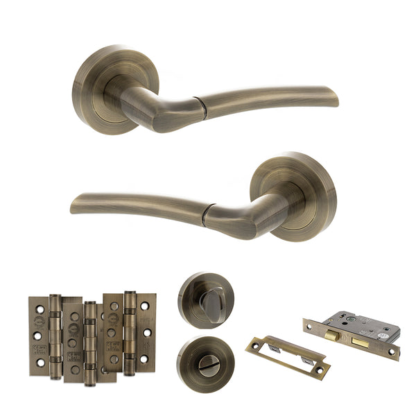 STATUS Indiana Door Handle Pack (Bathroom Set - 2.5" CE Bathroom Lock, 3" Fire Rated Hinges x3) - Antique Brass - ADPS33RAB8 - Choice Handles