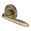 Heritage Brass Door Handle Lever Latch on Round Rose Sutton Reeded Design Antique Brass finish
UK Registered Design Number 6204750 - RR1752-AT - Choice Handles