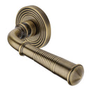 Heritage Brass Door Handle Lever Latch on Round Rose Bridgetown Reeded Design Antique Brass finish
UK Registered Design Number 6226297 - RR1935-AT - Choice Handles