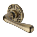 Heritage Brass Door Handle Lever Latch on Round Rose Charlbury Reeded Design Antique Brass finish - RR3022-AT - Choice Handles