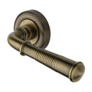 Heritage Brass Door Handle Lever on Rose Reeded Colonial Design Antique Brass Finish
 - V1936-AT - Choice Handles