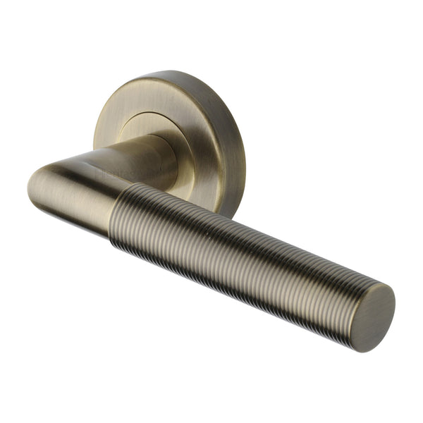 Heritage Brass Door Handle Lever Latch on Round Rose Bauhaus Mitre Reeded Design Antique Brass finish
 - V2274-AT - Choice Handles