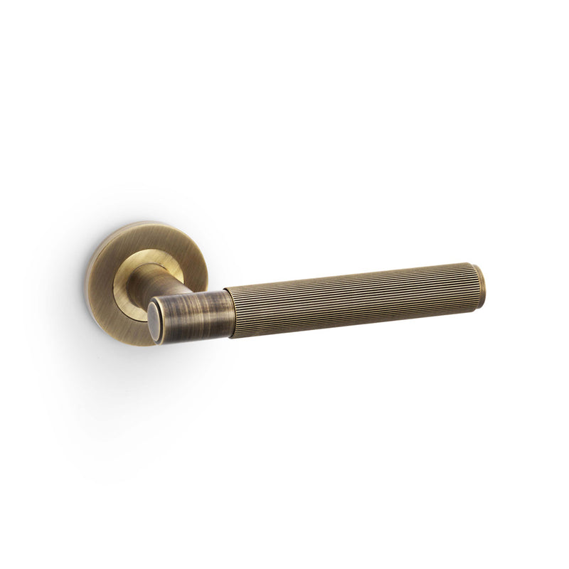 Alexander and Wilks - Spitfire Reeded Lever on Round Rose - Antique Brass - AW222AB