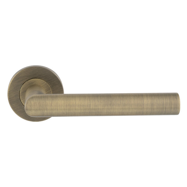 Eurospec - Mitred Round Bar Lever on Sprung Rose  - Antique Brass - CSL1192AB