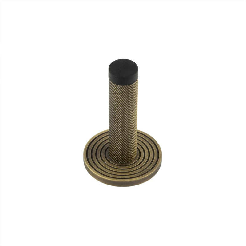 Burlington - Knurled Wall Mounted Doorstops Reeded Rose - Antique Brass - BUR-968AB-974AB - Choice Handles