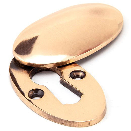 From The Anvil - Oval Escutcheon & Cover - Polished Bronze - 91992 - Choice Handles