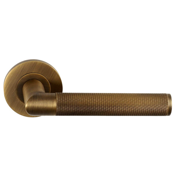 Alexander and Wilks - Harrier Knurled Lever on Round Rose - Antique Brass - AW210AB - Choice Handles