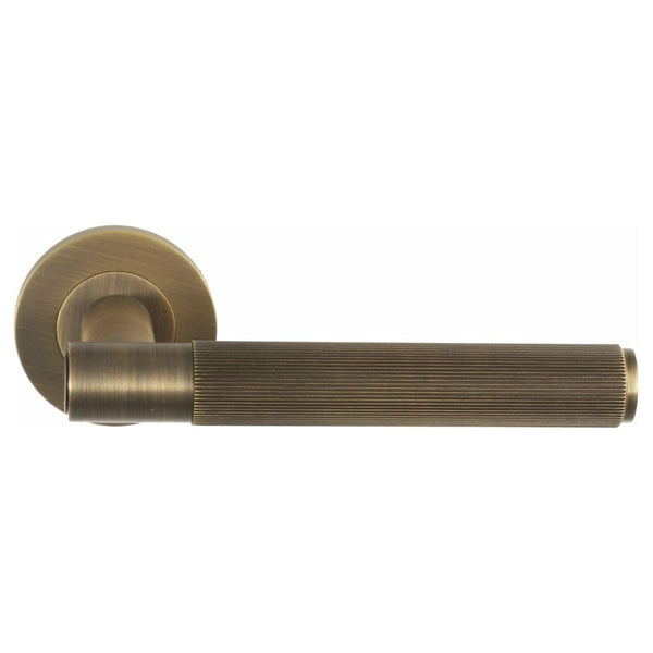 Alexander and Wilks - Spitfire Reeded Lever on Round Rose - Antique Brass - AW222AB - Choice Handles